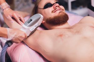 A man receiving laser hair removal Newark DE from Premier Spa & Laser Center.