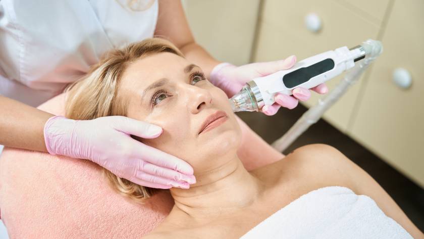 woman receives ulterapy treatment on face
