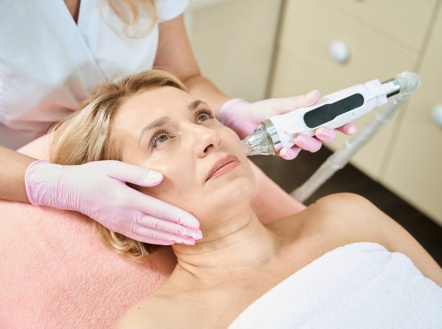 woman receives ulterapy treatment on face